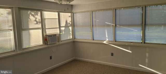 unfurnished sunroom with cooling unit