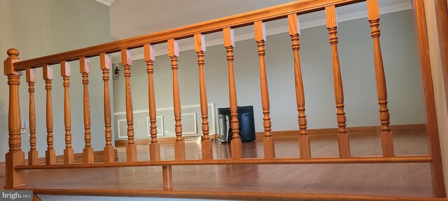 stairs featuring crown molding