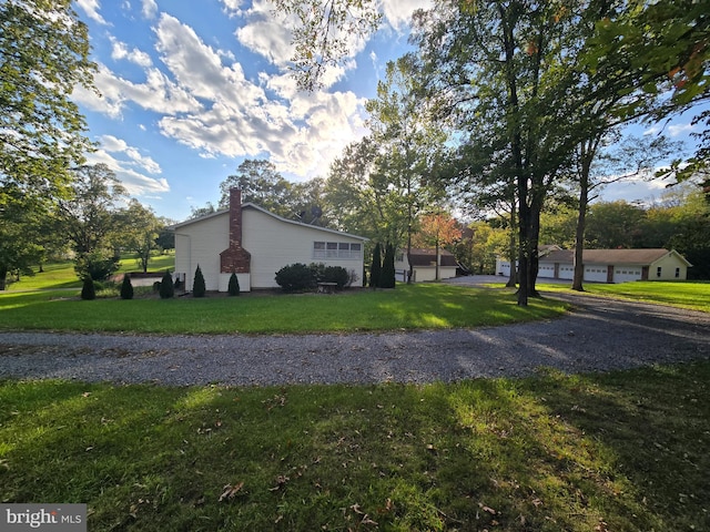 view of property exterior with a lawn