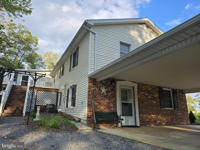 view of side of property with cooling unit