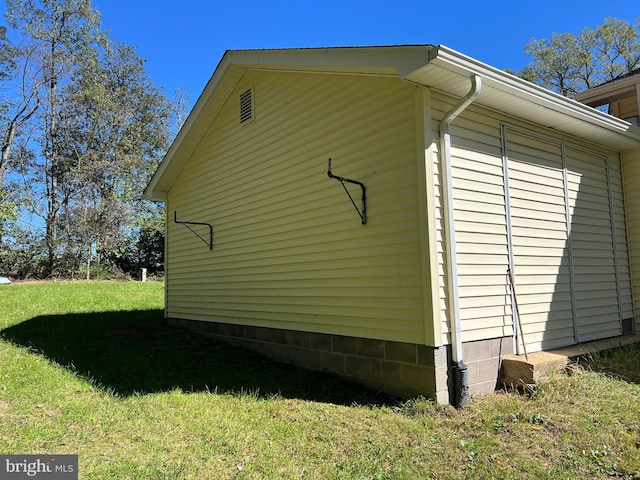 view of property exterior with a yard