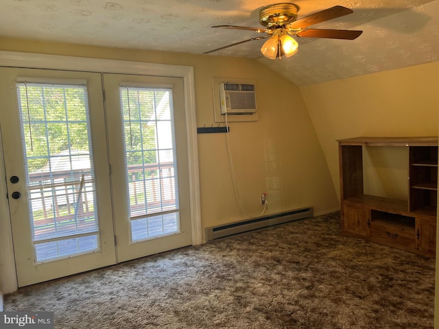 entryway with ceiling fan, a textured ceiling, baseboard heating, vaulted ceiling, and a wall unit AC