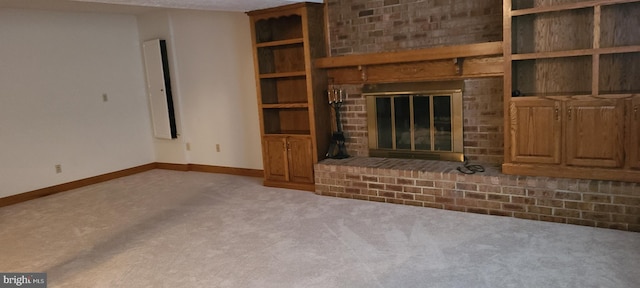 unfurnished living room featuring a fireplace and carpet