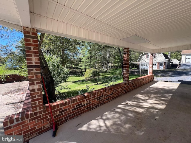 view of patio featuring a garage