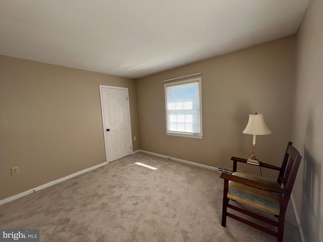 unfurnished room with light colored carpet