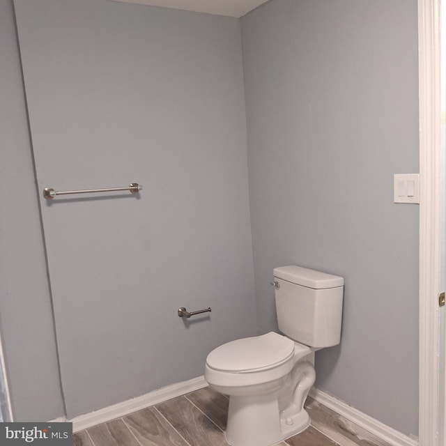 bathroom featuring toilet and hardwood / wood-style flooring