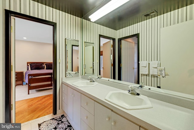 bathroom with vanity and hardwood / wood-style flooring