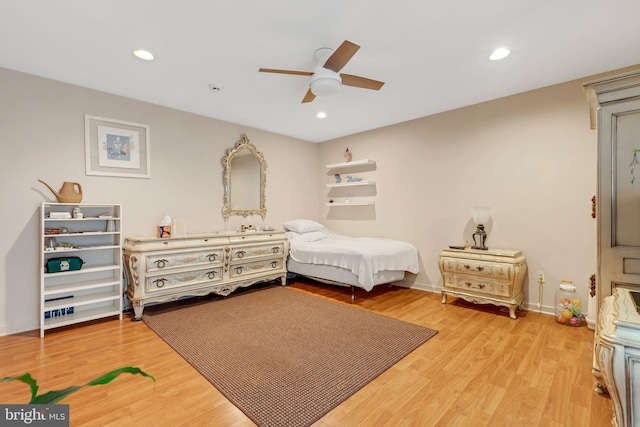 bedroom featuring hardwood / wood-style flooring and ceiling fan