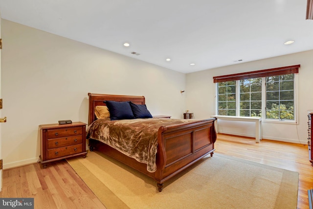 bedroom with light hardwood / wood-style floors