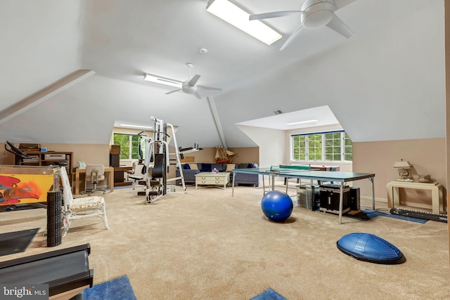 workout area with vaulted ceiling, a wealth of natural light, and ceiling fan