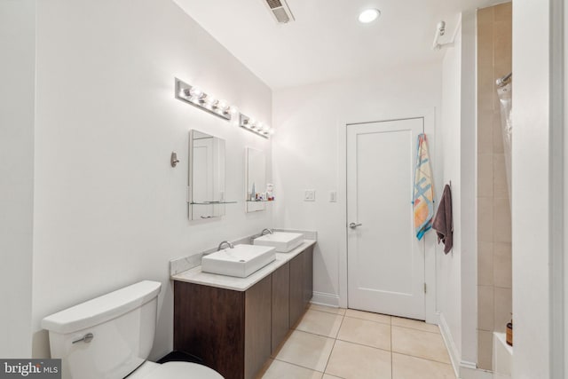 full bath with a sink, toilet, a shower, visible vents, and tile patterned floors