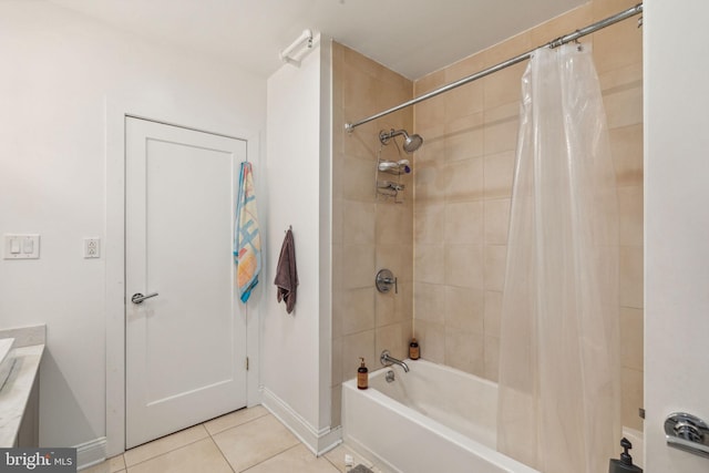 bathroom featuring vanity, shower / bath combo with shower curtain, and tile patterned flooring