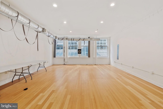 unfurnished living room with hardwood / wood-style floors