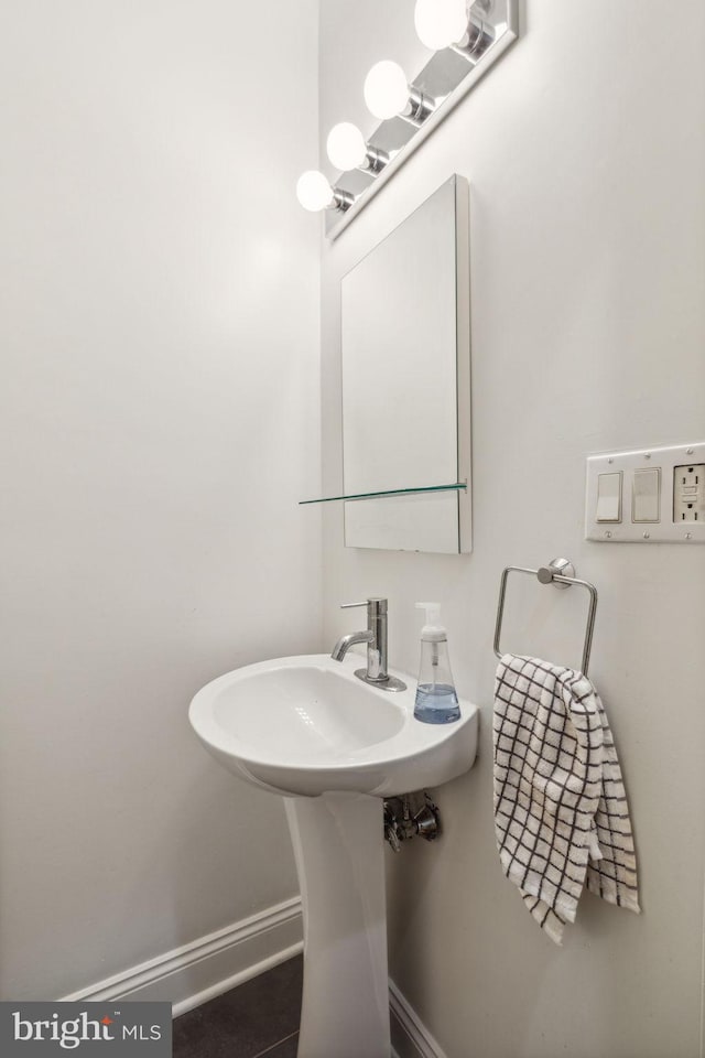 bathroom with tile patterned floors