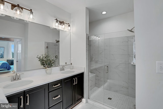 bathroom featuring walk in shower and vanity