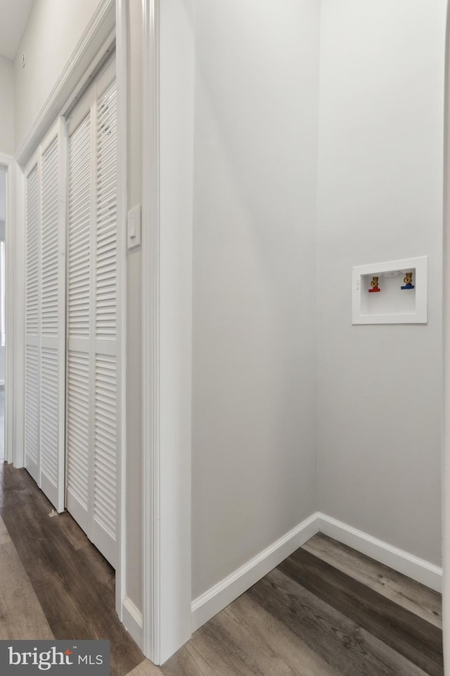 laundry area with hookup for a washing machine and dark hardwood / wood-style floors