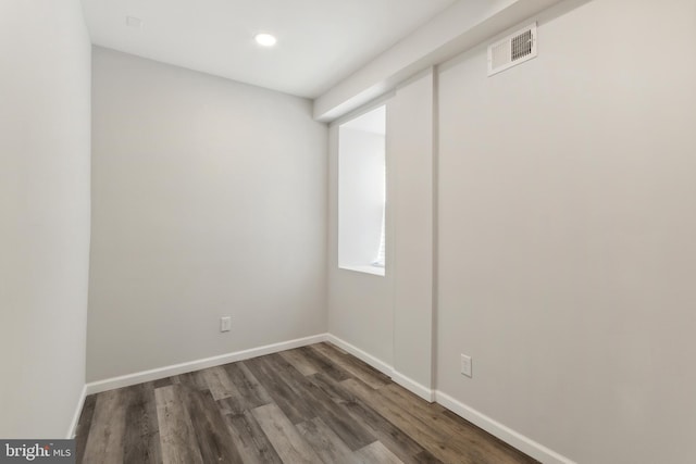 spare room with dark hardwood / wood-style flooring