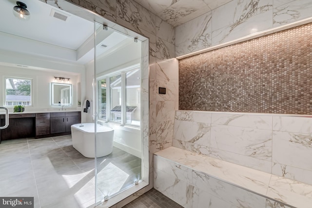 bathroom featuring vanity, independent shower and bath, and tile walls