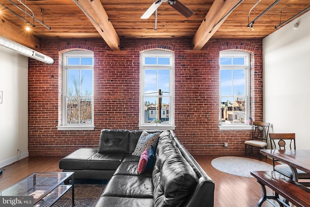 living room featuring wood ceiling, brick wall, ceiling fan, hardwood / wood-style flooring, and beam ceiling