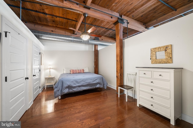 bedroom with dark wood-type flooring, wooden ceiling, and beamed ceiling