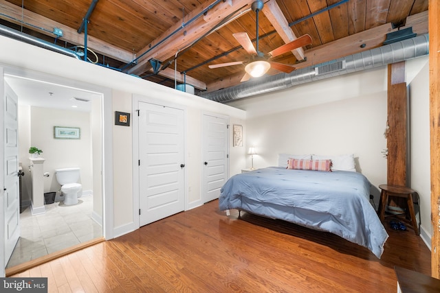 bedroom featuring hardwood / wood-style flooring, ceiling fan, wood ceiling, and ensuite bath