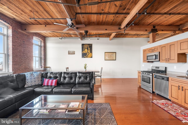 living room with wood ceiling, track lighting, and beamed ceiling