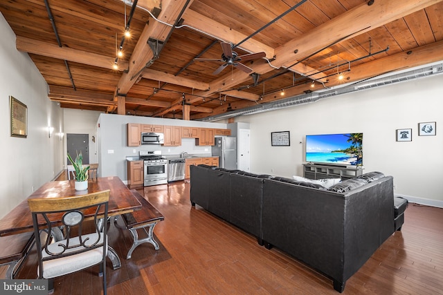 living room featuring wooden ceiling, track lighting, ceiling fan, hardwood / wood-style flooring, and beam ceiling