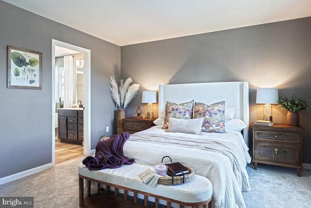 carpeted bedroom with ensuite bath