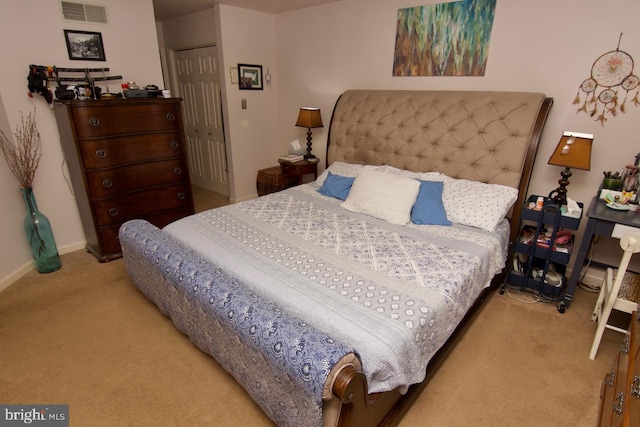 carpeted bedroom with a closet