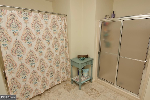 bathroom featuring walk in shower