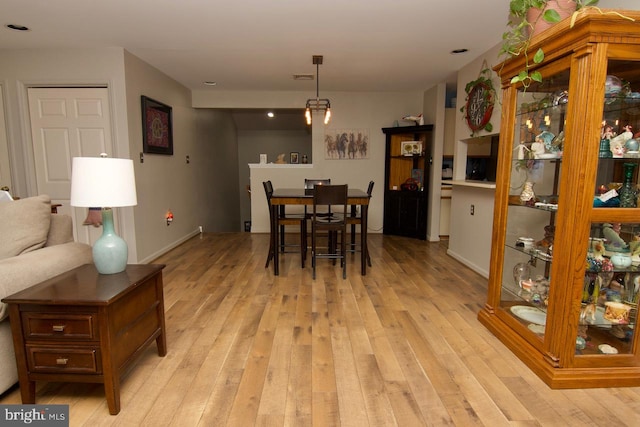 dining space featuring light hardwood / wood-style floors