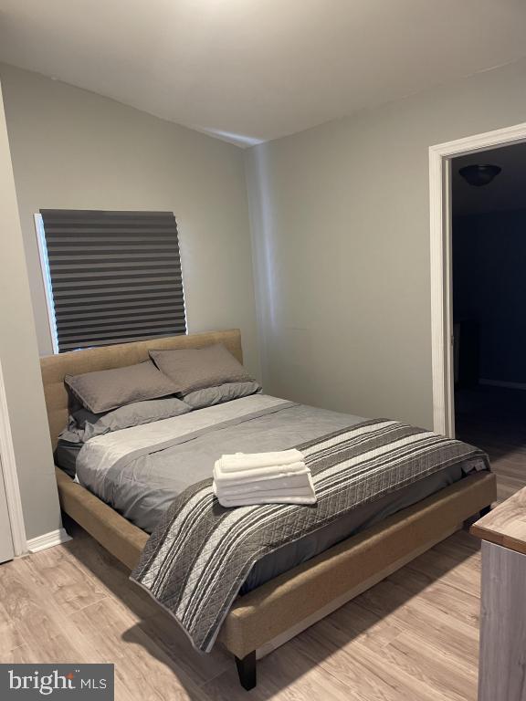 bedroom with light wood-type flooring