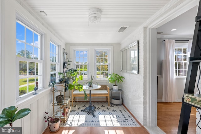 1307 Cleveland St, Alexandria, VA 22302 - sunroom / solarium featuring plenty of natural light, wood finished floors, and ornamental molding