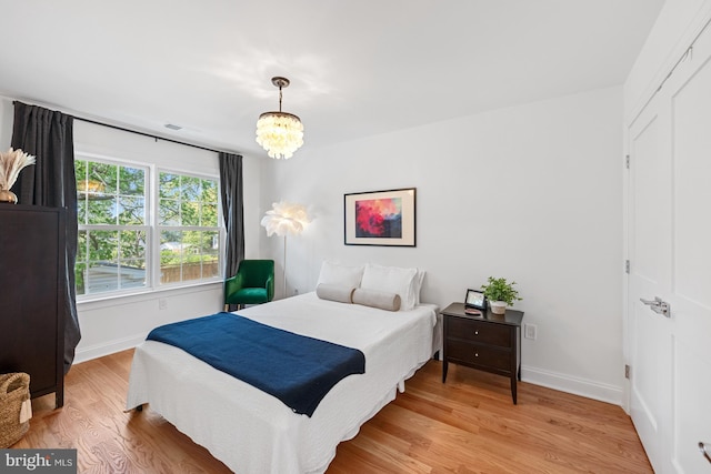 1307 Cleveland St, Alexandria, VA 22302 - bedroom featuring light wood-style floors and a chandelier