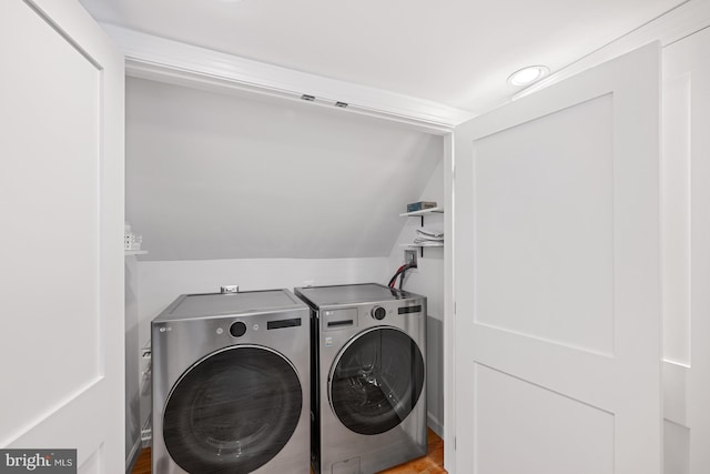 1307 Cleveland St, Alexandria, VA 22302 - laundry area with separate washer and dryer and wood finished floors