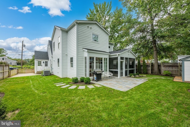 1307 Cleveland St, Alexandria, VA 22302 - rear view of property featuring a sunroom, a patio area, and a fenced backyard