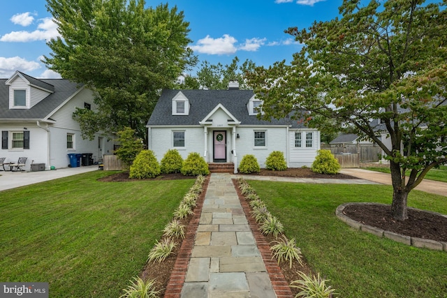 1307 Cleveland St, Alexandria, VA 22302 - cape cod home featuring a chimney, a shingled roof, and brick siding