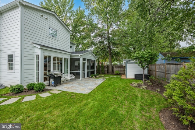 1307 Cleveland St, Alexandria, VA 22302 - fenced backyard with a sunroom, a patio area, and a shed