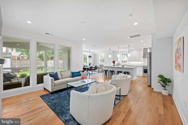 1307 Cleveland St, Alexandria, VA 22302 - living room featuring light wood-type flooring and recessed lighting