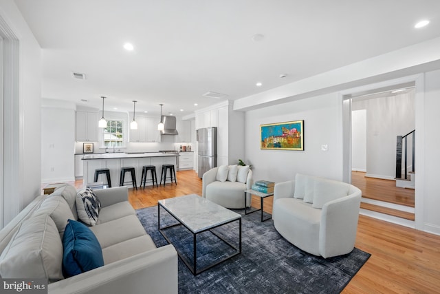 1307 Cleveland St, Alexandria, VA 22302 - living room with light wood finished floors and recessed lighting