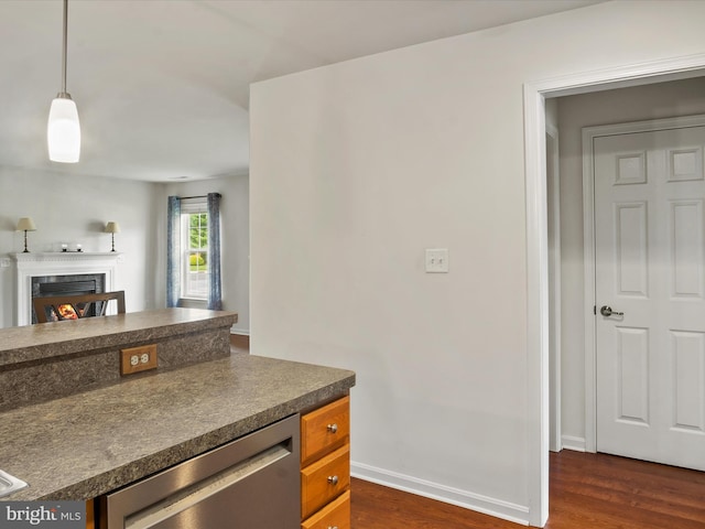 kitchen with wine cooler, decorative light fixtures, and dark hardwood / wood-style flooring