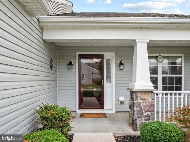 doorway to property featuring a porch