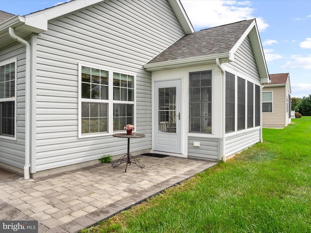 exterior space with a lawn and a patio area