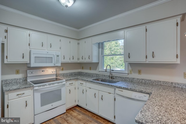 kitchen featuring white appliances, sink, light hardwood / wood-style floors, crown molding, and white cabinetry