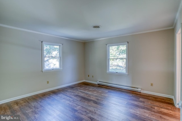 empty room featuring wood-type flooring, a baseboard heating unit, and a healthy amount of sunlight