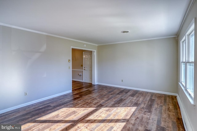 spare room featuring crown molding and dark wood-type flooring