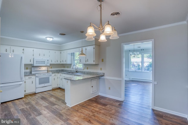 kitchen with plenty of natural light, white appliances, white cabinets, and a baseboard radiator