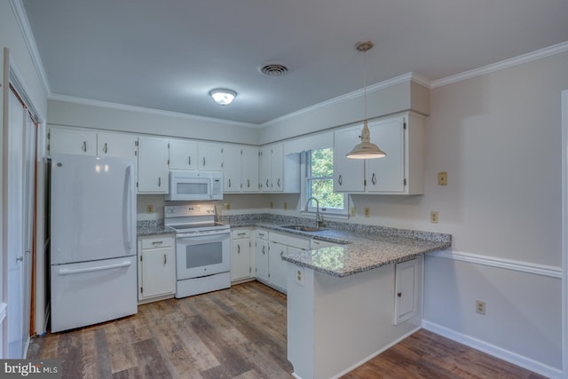 kitchen with white appliances, decorative light fixtures, sink, hardwood / wood-style flooring, and white cabinetry