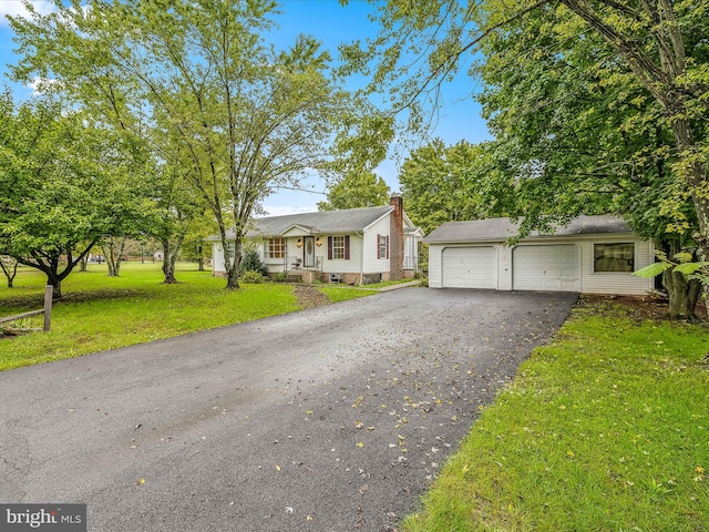 view of front of property with a front lawn, a porch, and a garage