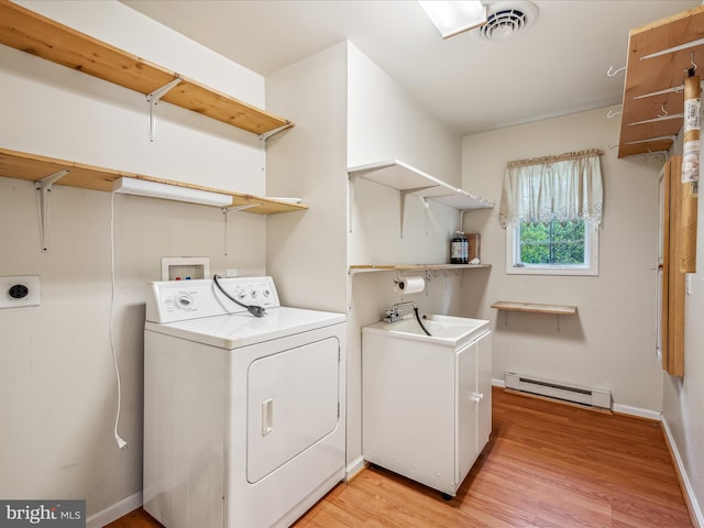 laundry room featuring a baseboard radiator, light hardwood / wood-style floors, hookup for a washing machine, and sink